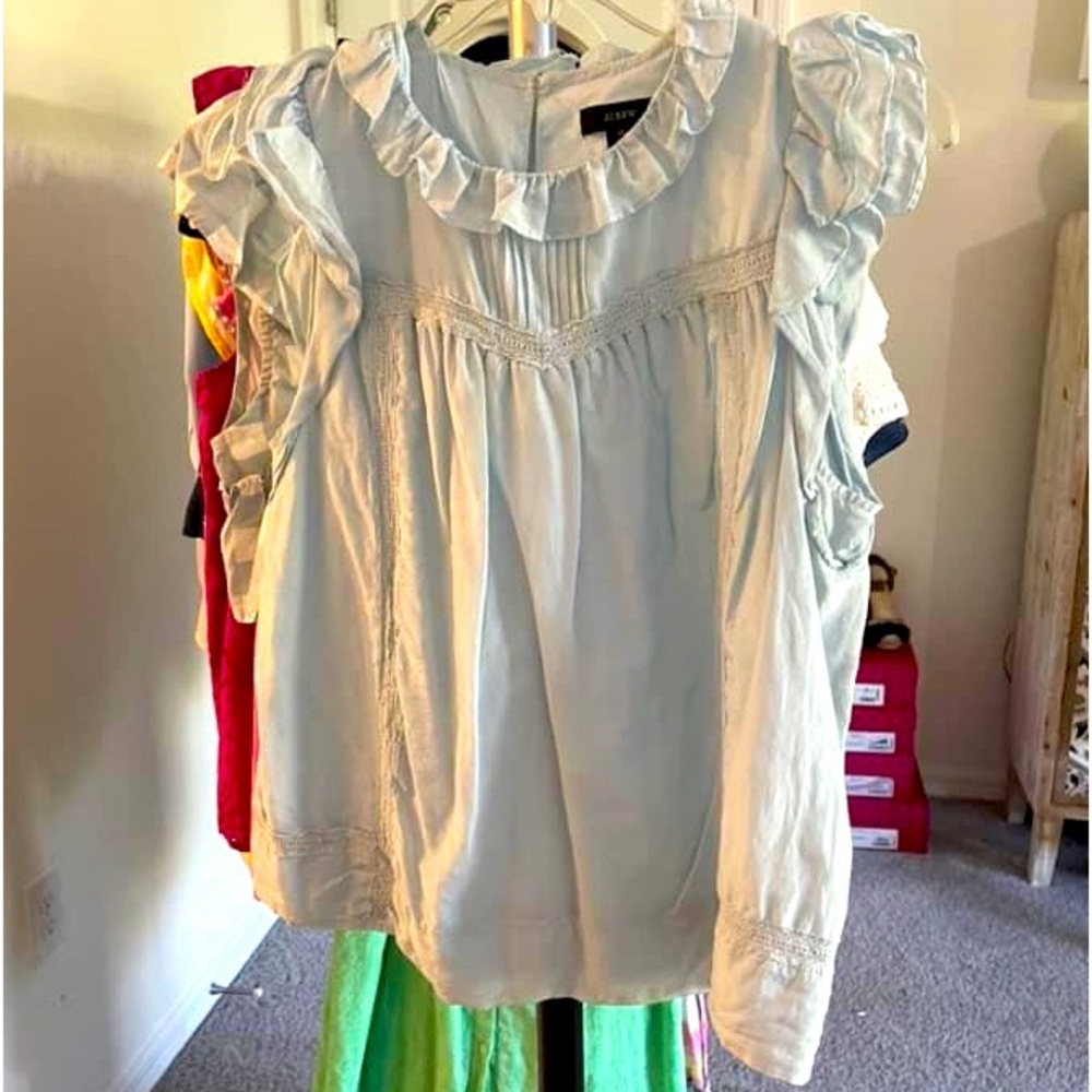 J Crew specialty store soft blue ruffle top. Worn once. Size med.